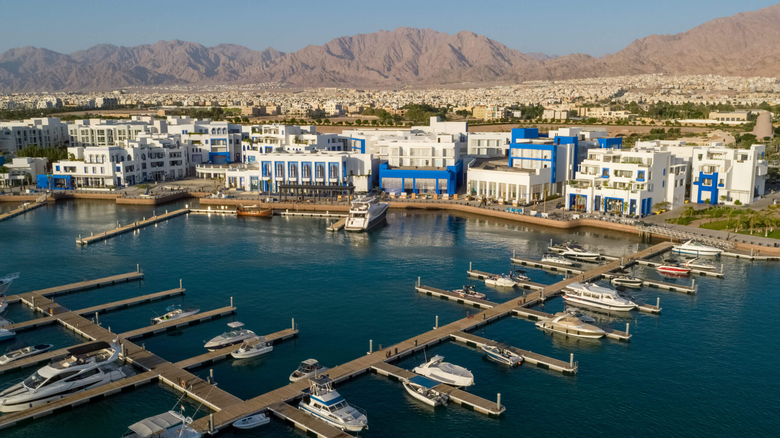 Marina view with buildings and boats.
